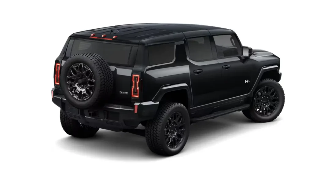 2025 Hummer EV SUV performing crabwalk maneuver on sand